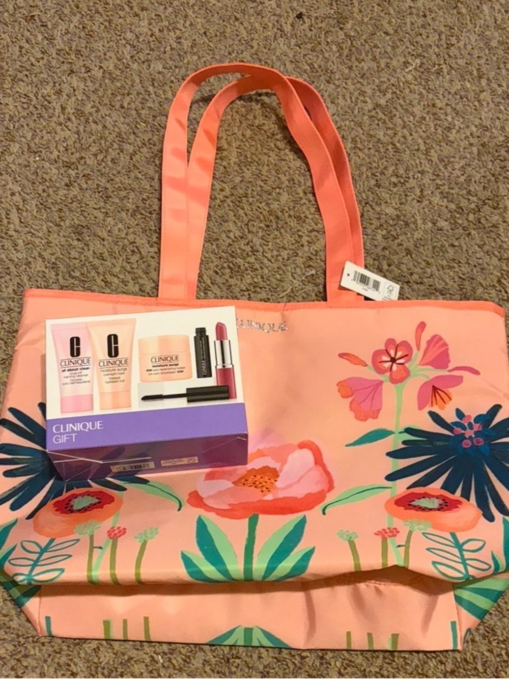 Clinique Coral Pink Floral Tote with Multicolor Blossoms with skincare set